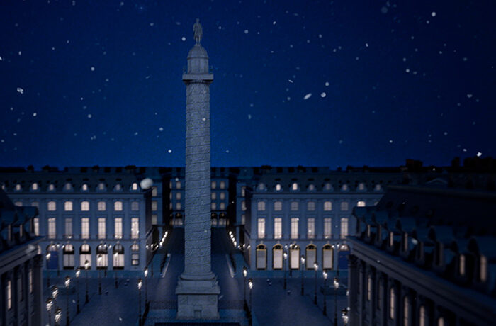 Night scene of Place Vendôme, elegantly illuminated, with a gentle snowfall